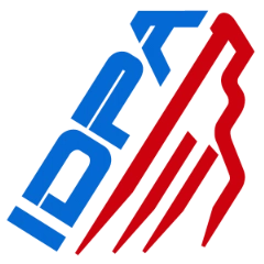Abstract logo with the word "IDOL" in blue, slanted upward, alongside three red zigzag lines resembling mountains or sound waves, also slanted to the right. The design features sharp angles and a modern style.
